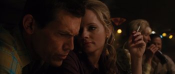 Movie still from “W.” (2008), directed by Oliver Stone – A man and a woman sitting next to each other; Close Up shot, Over the shoulder angle