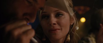 Movie still from “W.” (2008), directed by Oliver Stone – A woman's face as a man looks on; Close Up shot, Over the shoulder angle