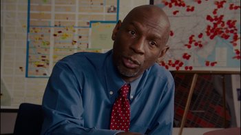 Movie still from “Waiting for Superman” (2010), directed by Davis Guggenheim – A man in a blue shirt and a red tie; Close Up shot, Over the shoulder angle
