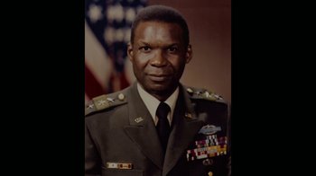 Movie still from “Waiting for Superman” (2010), directed by Davis Guggenheim – An older man in a military uniform with medals around his neck; Close Up shot, High angle