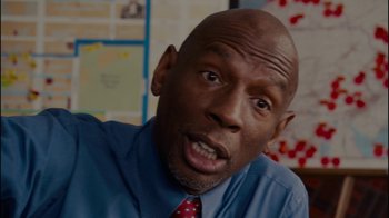 Movie still from “Waiting for Superman” (2010), directed by Davis Guggenheim – A person wearing a shirt and a tie; Close Up shot, Over the shoulder angle