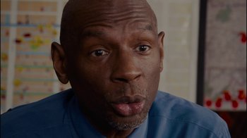 Movie still from “Waiting for Superman” (2010), directed by Davis Guggenheim – A person with a blue shirt; Close Up shot, Over the shoulder angle