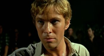 Movie still from “Wake in Fright” (1971), directed by Ted Kotcheff – A man's face in a dark room; Close Up shot, Low angle