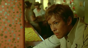 Movie still from “Wake in Fright” (1971), directed by Ted Kotcheff – A person in a mirror; Close Up shot, Low angle