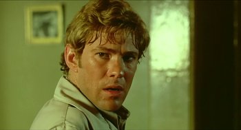 Movie still from “Wake in Fright” (1971), directed by Ted Kotcheff – A person wearing a jacket; Close Up shot, Low angle