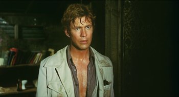 Movie still from “Wake in Fright” (1971), directed by Ted Kotcheff – A person wearing a jacket; Close Up shot, Low angle