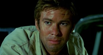 Movie still from “Wake in Fright” (1971), directed by Ted Kotcheff – A man's face in the dark; Close Up shot, Low angle