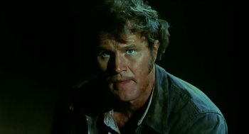 Movie still from “Wake in Fright” (1971), directed by Ted Kotcheff – A person wearing a jacket; Close Up shot, Low angle
