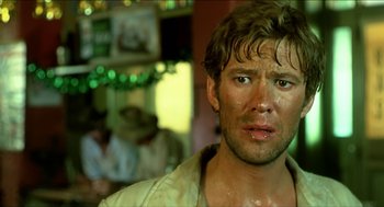 Movie still from “Wake in Fright” (1971), directed by Ted Kotcheff – A person wearing a shirt; Close Up shot, Low angle
