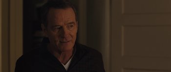 Movie still from “Wakefield” (2016), directed by Robin Swicord – An older man in a black jacket looking at the camera; Close Up shot, Over the shoulder angle