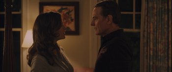 Movie still from “Wakefield” (2016), directed by Robin Swicord – A man and a woman standing next to each other in a room; Medium shot, Over the shoulder angle