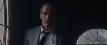 Movie still from “Wakefield” (2016), directed by Robin Swicord – A person wearing a suit and tie; Close Up shot, Over the shoulder angle