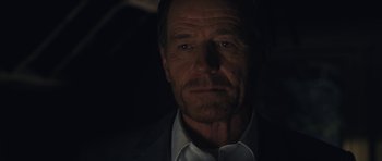 Movie still from “Wakefield” (2016), directed by Robin Swicord – A person wearing a suit and tie; Close Up shot, Over the shoulder angle