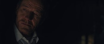 Movie still from “Wakefield” (2016), directed by Robin Swicord – An old man with a white shirt is looking at the camera; Extreme Close Up shot, Over the shoulder angle