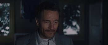 Movie still from “Wakefield” (2016), directed by Robin Swicord – A person wearing a suit and tie; Close Up shot, Over the shoulder angle