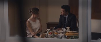 Movie still from “Wakefield” (2016), directed by Robin Swicord – A man and a woman sitting at a dinner table; Medium shot, Over the shoulder angle