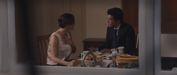 Movie still from “Wakefield” (2016), directed by Robin Swicord – A man and a woman sitting at a dinner table; Medium shot, Over the shoulder angle