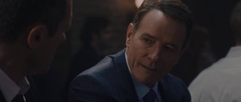 Movie still from “Wakefield” (2016), directed by Robin Swicord – A person wearing a suit and tie; Close Up shot, Over the shoulder angle