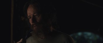 Movie still from “Wakefield” (2016), directed by Robin Swicord – A person with long hair and a beard; Close Up shot, Over the shoulder angle