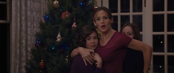 Movie still from “Wakefield” (2016), directed by Robin Swicord – A woman standing next to a girl in front of a christmas tree; Medium shot, Over the shoulder angle
