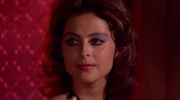 Movie still from “Walking Tall” (1973), directed by Phil Karlson – A person wearing makeup on their face; Close Up shot, Over the shoulder angle