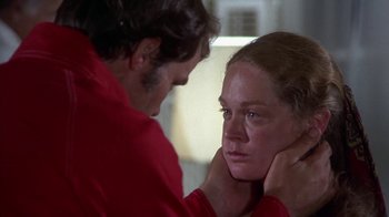 Movie still from “Walking Tall” (1973), directed by Phil Karlson – A man and a woman in a room; Close Up shot, Over the shoulder angle