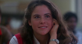Movie still from “WarGames” (1983), directed by John Badham – A person sitting with her hand under her chin; Close Up shot, Low angle