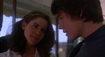 Movie still from “WarGames” (1983), directed by John Badham – A young man and a young woman looking at one another; Close Up shot, Over the shoulder angle