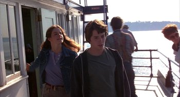 Movie still from “WarGames” (1983), directed by John Badham – A man and a woman walking on a pier; Medium shot, Over the shoulder angle