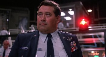 Movie still from “WarGames” (1983), directed by John Badham – A person wearing a military uniform; Close Up shot, Low angle