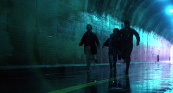 Movie still from “WarGames” (1983), directed by John Badham – A group of people running through a tunnel; Wide shot, Low angle