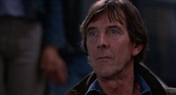 Movie still from “WarGames” (1983), directed by John Badham – A person looking up at something; Close Up shot, Over the shoulder angle