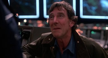 Movie still from “WarGames” (1983), directed by John Badham – A person sitting in a room; Close Up shot, Low angle