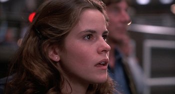 Movie still from “WarGames” (1983), directed by John Badham – A person looking at the camera; Close Up shot, Low angle