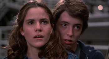 Movie still from “WarGames” (1983), directed by John Badham – A young woman standing next to a young man; Close Up shot, Low angle