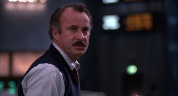 Movie still from “WarGames” (1983), directed by John Badham – An older man with a beard and a mustache; Close Up shot, Low angle