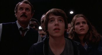Movie still from “WarGames” (1983), directed by John Badham – A group of people standing in a dark room; Close Up shot, Low angle
