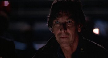 Movie still from “WarGames” (1983), directed by John Badham – A person wearing a black jacket; Close Up shot, Low angle