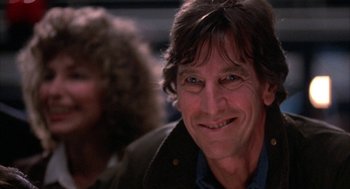Movie still from “WarGames” (1983), directed by John Badham – A person smiling; Close Up shot, Low angle