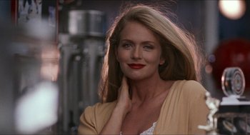 Movie still from “Wayne's World” (1992), directed by Penelope Spheeris – A woman with long blonde hair and red lipstick; Close Up shot, Low angle