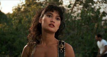 Movie still from “Wayne's World” (1992), directed by Penelope Spheeris – A beautiful woman with long black curly hair; Close Up shot, Low angle