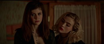 Movie still from “We Summon the Darkness” (2019), directed by Marc Meyers – Two young women standing next to each other in a room; Close Up shot, Over the shoulder angle