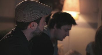 Movie still from “Weekend” (2011), directed by Andrew Haigh – Two men sitting side by side in front of a laptop; Close Up shot, Over the shoulder angle
