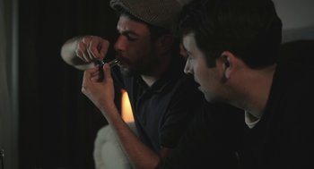 Movie still from “Weekend” (2011), directed by Andrew Haigh – Two men sitting in front of each other; Close Up shot, High angle