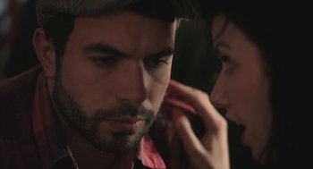 Movie still from “Weekend” (2011), directed by Andrew Haigh – A man and a woman looking at one another; Extreme Close Up shot, Over the shoulder angle