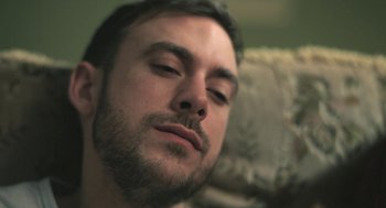 Movie still from “Weekend” (2011), directed by Andrew Haigh – A person with a mustache; Close Up shot, Low angle
