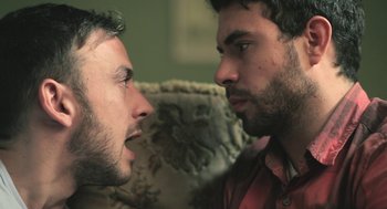 Movie still from “Weekend” (2011), directed by Andrew Haigh – A couple of people that are staring at each other; Close Up shot, Over the shoulder angle