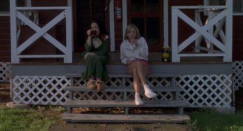 Movie still from “Wet Hot American Summer” (2001), directed by David Wain – Two women sitting on the steps of a house; Wide shot, Low angle