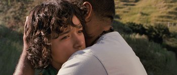 Movie still from “Whale Rider” (2002), directed by Niki Caro – A man and a woman hugging in a field; Close Up shot, Over the shoulder angle