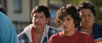 Movie still from “Whale Rider” (2002), directed by Niki Caro – Two young boys are standing next to each other; Close Up shot, Over the shoulder angle